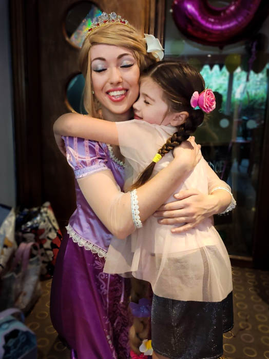 Princess Appearances Essex with princess hugging a young birthday girl